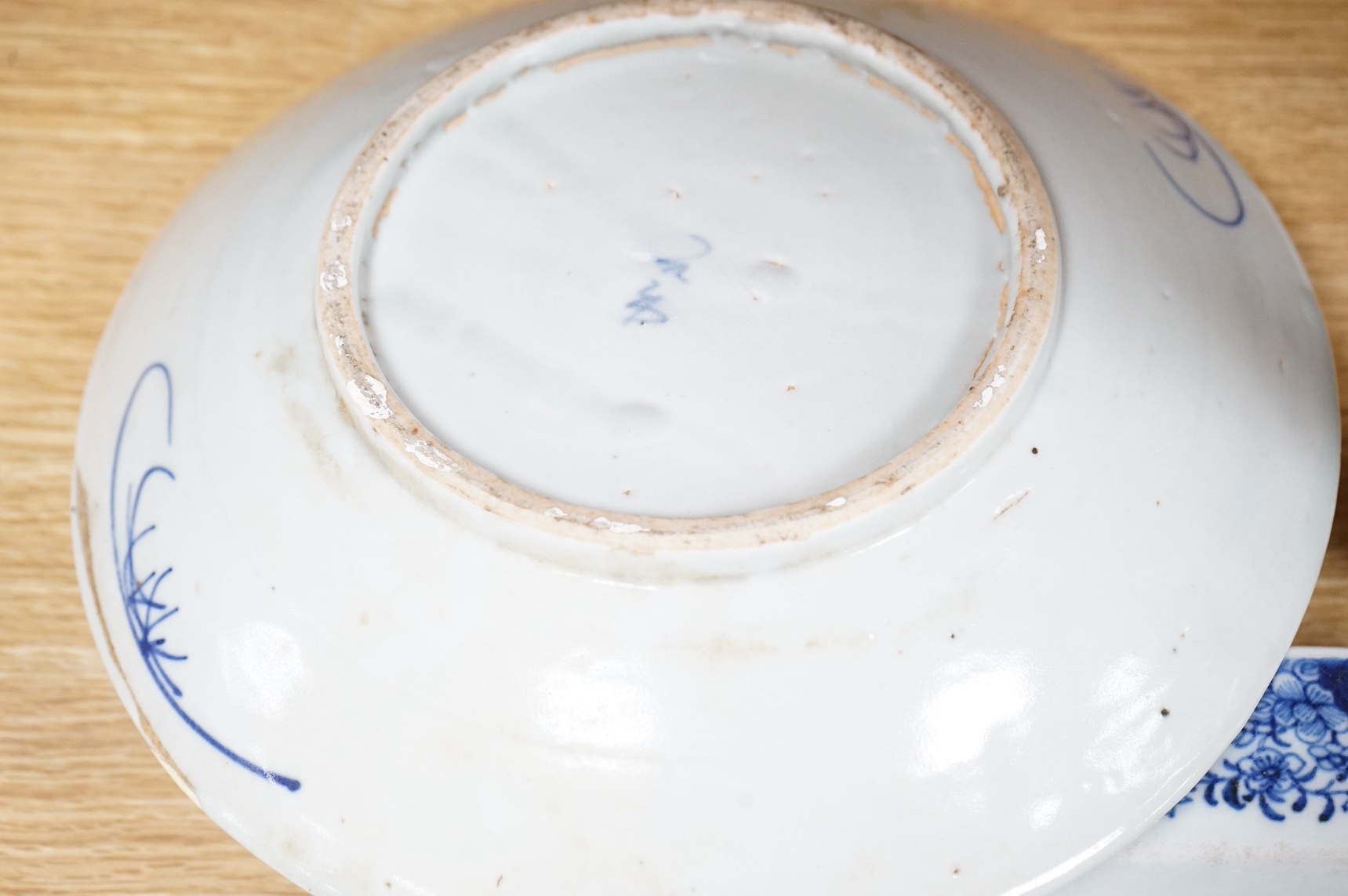 A 18th century Chinese export blue and white octagonal serving dish and two blue and white dishes, largest 38cm wide. Condition - one plate cracked